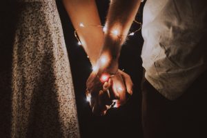 man-and-woman-holding-each-others-hand-wrapped-with-string-792777